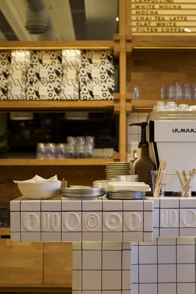 Stylish café interior in Gaziantep featuring a coffee counter with a La Marzocco machine.